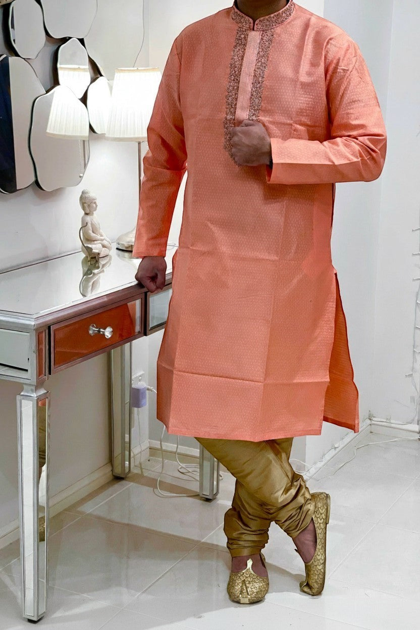 Panache peach jacquard kurta payjama set with embroidered neckline and gold payjama pants.