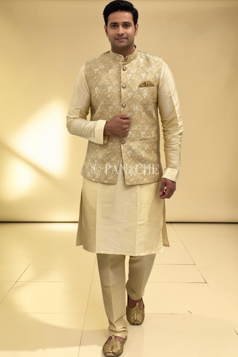 Panache By Divya cream silk kurta pajama set with a matching embroidered Nehru jacket and pocket square. Traditional Indian menswear.